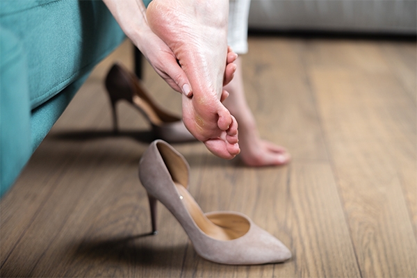 Wearing high heels can cause cracked heels.