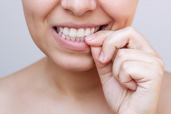 Biting your nails can damage the nails and cuticle area.