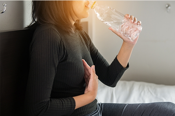 Taking small sip wwater can help push acid back down into the stomach.